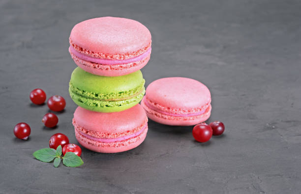 istock Sweet pink and green macaroons or macarons with cranberry and mint 904057012