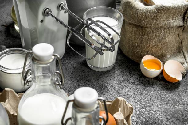 istock Baking background. Milk, flour and other ingredients for the dough. 904059722