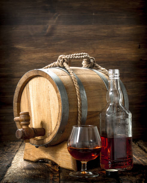 istock Cognac in a barrel with a glass. 904063408