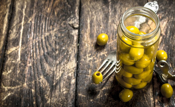 istock Pickled olives in glass jar. 904064290