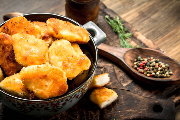 istock Fresh chicken nuggets with sauce and spices. 904069424