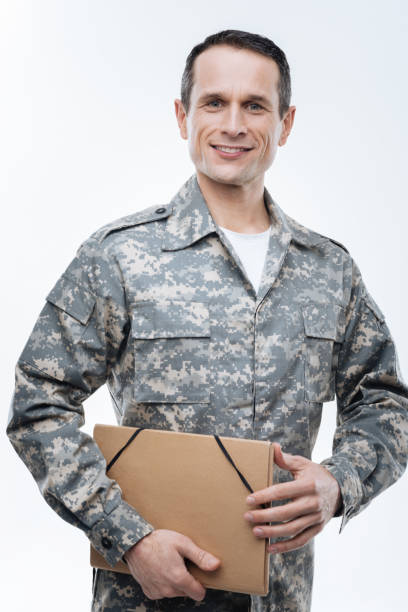 istock Positive military man holding a folder 904069796