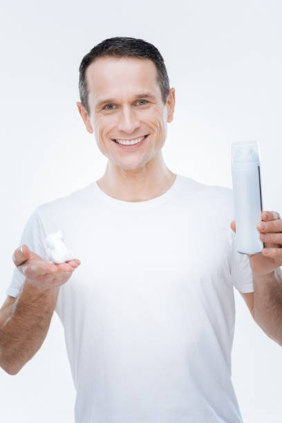 istock Nice happy man having shaving foam in his hands 904069820