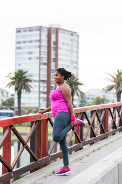 istock Woman stretching to warm down 904072272