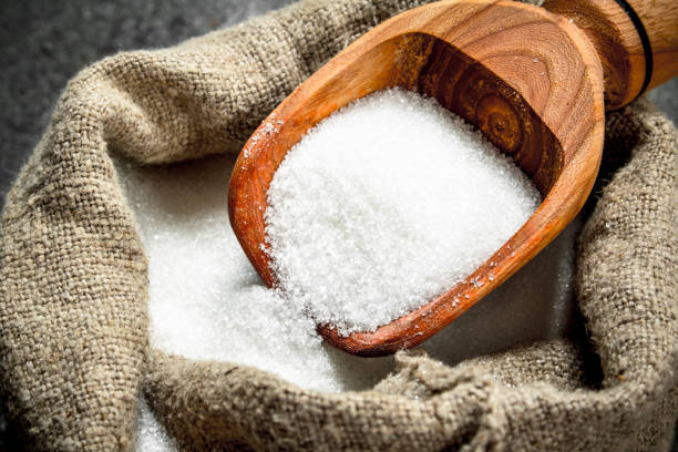 istock Sugar in an old sack with a scoop. 904072696