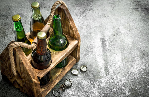 Old box with beer. On rustic background. Old box with beer. On a rustic background. beer crate stock pictures, royalty-free photos & images
