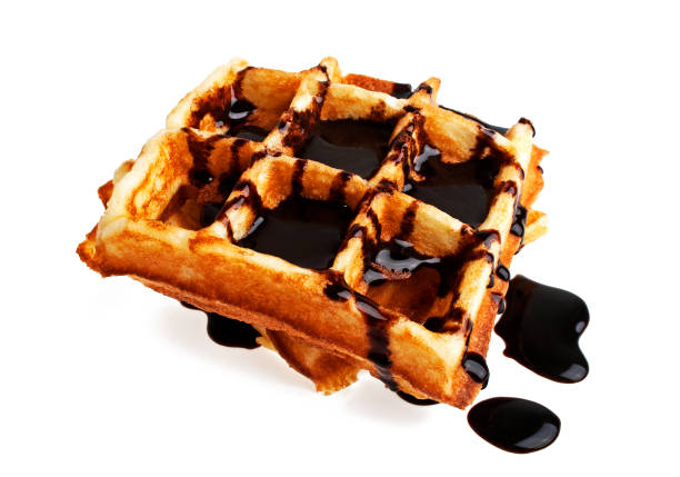 istock Freshly baked belgium waffles with chocolate on white background 904072998