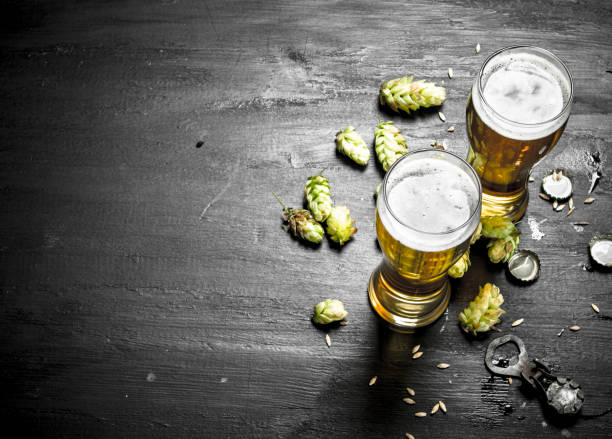 istock Glasses with beer and green hops. 904073492