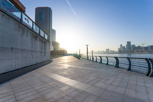istock modern buildings near water in modern city 904073740