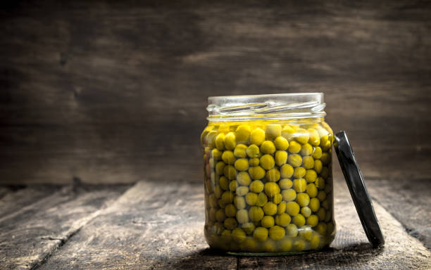 istock Pickled green peas in glass jar. 904075316