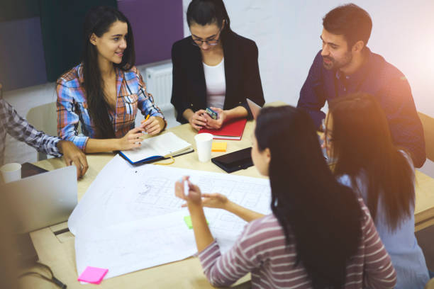 istock Diversity group of talented engineers actively discussing business startup project ideas and surfing information using modern technology,hipster guys talking in friendly atmosphere during work break 904082782