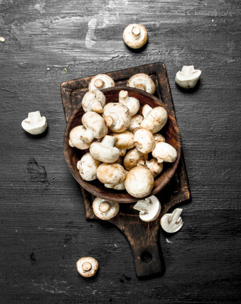 istock Fresh mushrooms on the board. 904083184