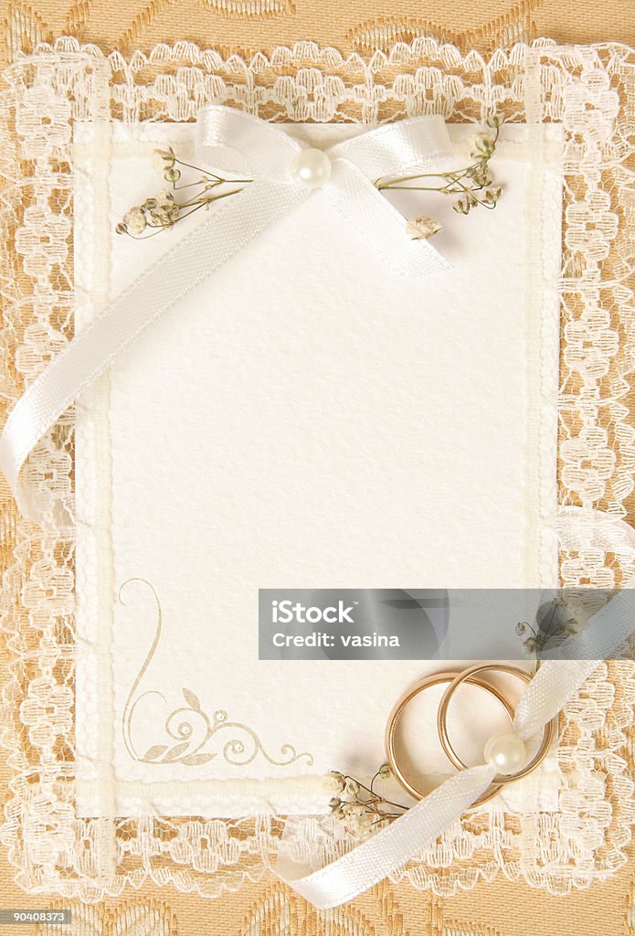 wedding invitation card wedding invitation card with golden wedding rings Pearl Jewelry Stock Photo