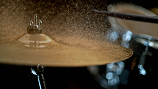 SLO MO Drumstick striking a wet cymbal