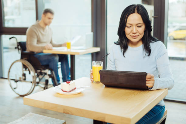 istock Inspired woman drinking juice and working 904083846