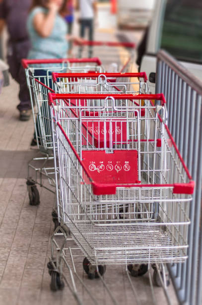 istock Push Cart lined up ouside of a store 904084630