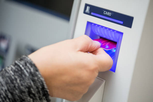 istock Senior woman inserting credit card in ATM machine 904084714