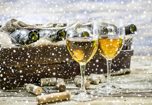 istock Two white wine glasses. New Year celebration background. 904094216