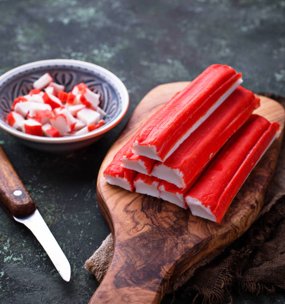istock Crab sticks surimi and knife 904098458