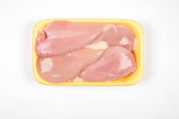 istock Raw chicken fillet package isolated on white background. 904102438