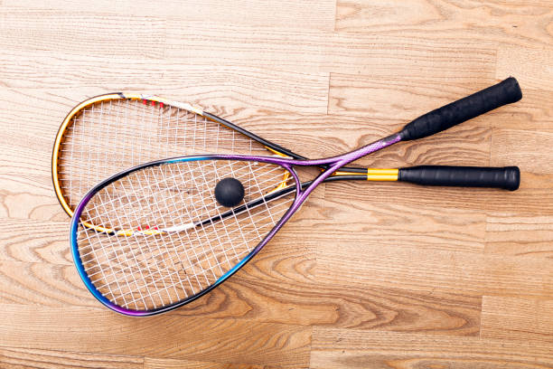 istock Squash racket and ball on the court 904102826