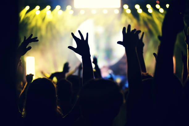 istock Crowd rocking during a concert with raised arms. 904106108