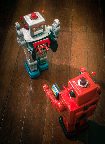 istock two retro  robots   fight  on a wooden 904109352