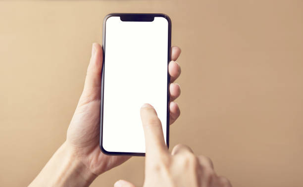 Close up hand holding black smartphone on white clipping path inside