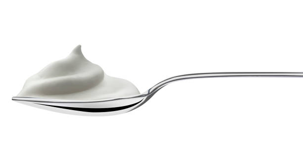 istock spoon filled of milk cream 904110082