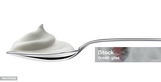 Spoon Filled Of Milk Cream Stock Photo - Download Image Now - Yogurt, Spoon, Cut Out