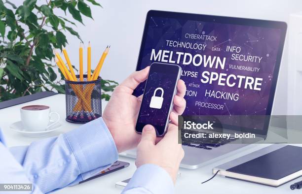 Meltdown And Spectre Threat Concept On Laptop And Smartphone Screen Stock Photo - Download Image Now
