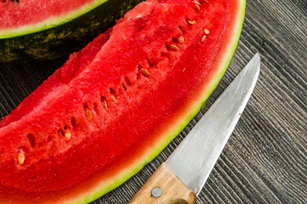 istock watermelon cut with a quarter-size knife, red watermelon 904118604
