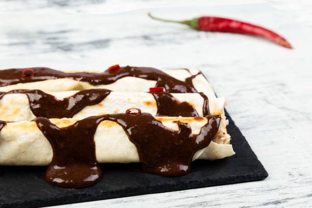 istock Mexican chicken enchiladas with chili chocolate salsa 904121688
