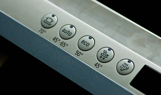 Dishwasher buttons for temperature settings.