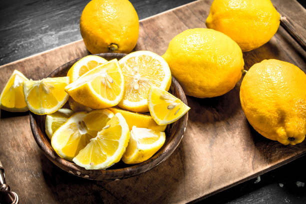 istock Slicing fresh lemons on the board. 904122188