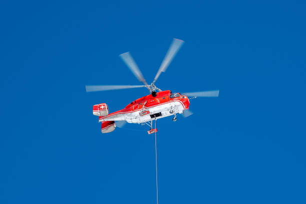 Red rescue helicopter with basket stock photo