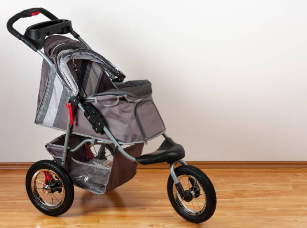 New modern comfortable grey pet stroller, studio shot stock photo