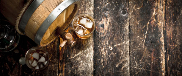 istock barrel of Scotch whiskey with a glass. 904123328
