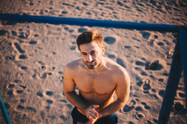 istock Young Handsome man at the outdoor workout area 904124110