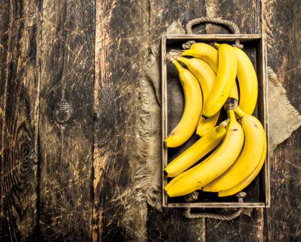 istock Fresh bananas on an old tray. 904130728