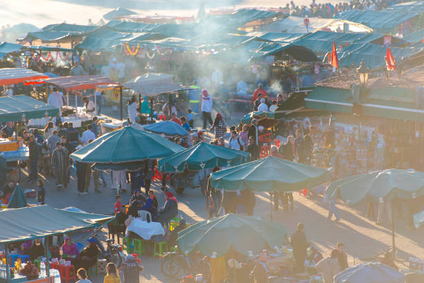 panoramic view of marrakech or marrakesh with the old part of town medina and jamaa el fna market square - djemma el fna square imagens e fotografias de stock