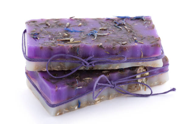 istock Two handmade soaps with wildflowers isolated on white background 904131232