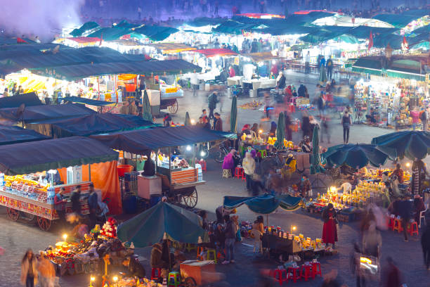 panoramic view of marrakech or marrakesh with the old part of town medina and jamaa el fna market square - djemma el fna square imagens e fotografias de stock