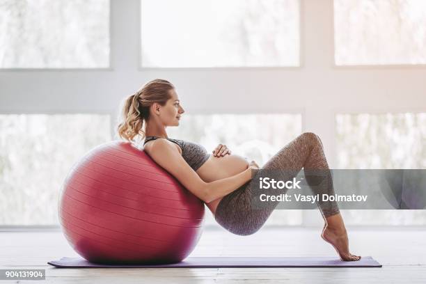 Pregnant Woman Workout Stock Photo - Download Image Now - Pregnant, Exercising, Women