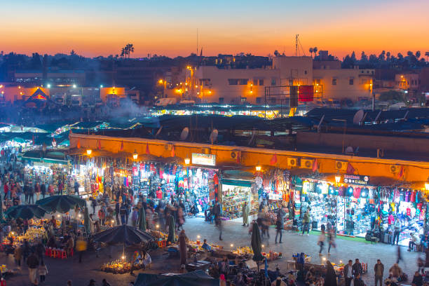 panoramic view of marrakech or marrakesh with the old part of town medina and jamaa el fna market square - djemma el fna square imagens e fotografias de stock