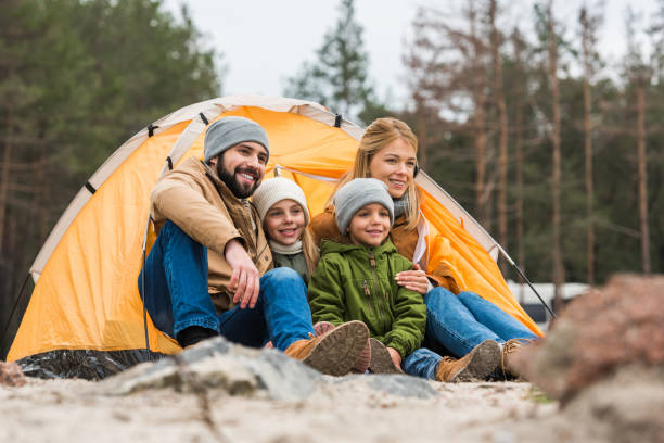 istock family sitting near tent 904137122