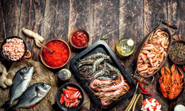 istock Different seafood with shrimps and red caviar. 904138442