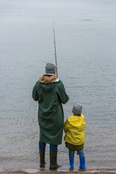 istock father and son fishing together 904141672