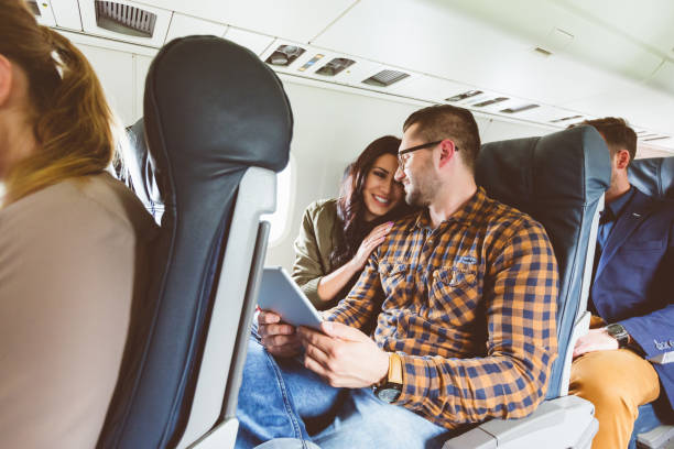 istock Couple traveling by airplane 904141894