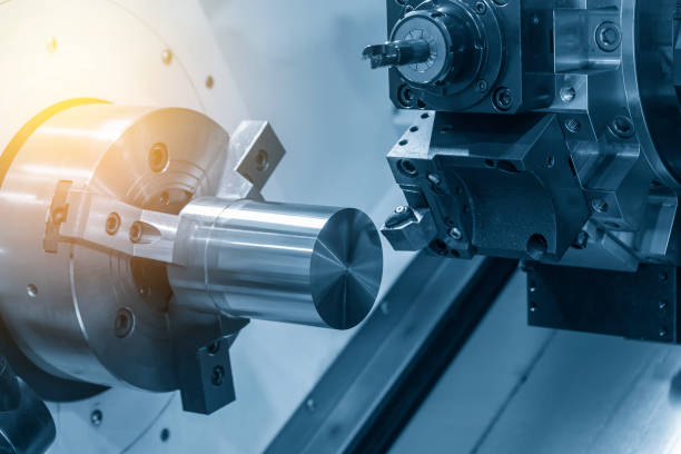 istock The  CNC lathe machine cutting the steel rod . 904141996